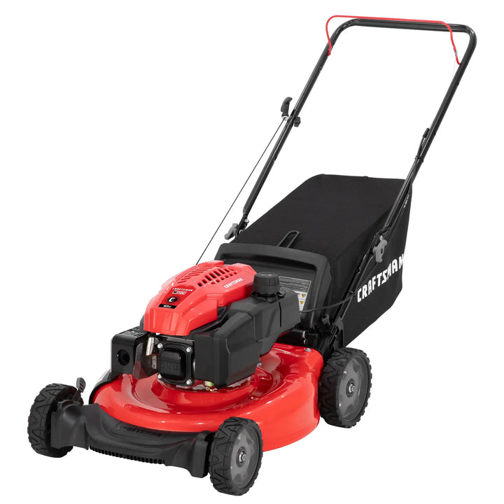 Photo of Craftsman walk-behind lawn mower CM11A-A2C2093 with red deck, black engine, and rear grass bag, angled view.