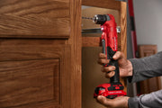 Photo of Craftsman right angle cordless drill CMCD750B in use, drilling inside a wooden cabinet.