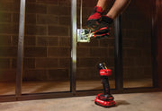 Photo of a CRAFTSMAN cordless LED work light, SKU CMCL020B, on a concrete floor illuminating electrical work.
