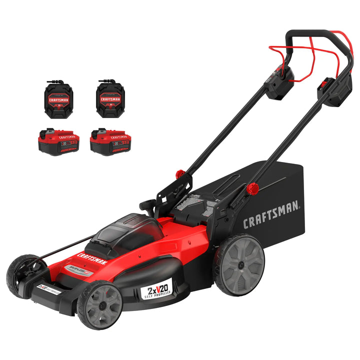 Photo of Craftsman CMCMWSP220P2 red and black lawn mower with two batteries and two chargers, side angle.