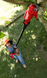 Photo of Craftsman pole pruner CMCPPR320D1 trimming tree branch outdoors.