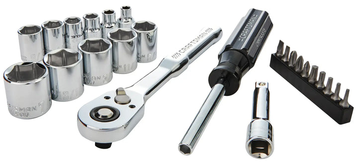 A set of chrome socket wrenches, including a ratchet handle, screwdriver, various sockets in different sizes, an extension bar, and a set of screwdriver bits, all arranged on a white background.