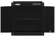 A black metal wall cabinet with open doors, featuring two interior shelves. The cabinet has 'CRAFTSMAN' branding and a USA flag label on the upper left corner.